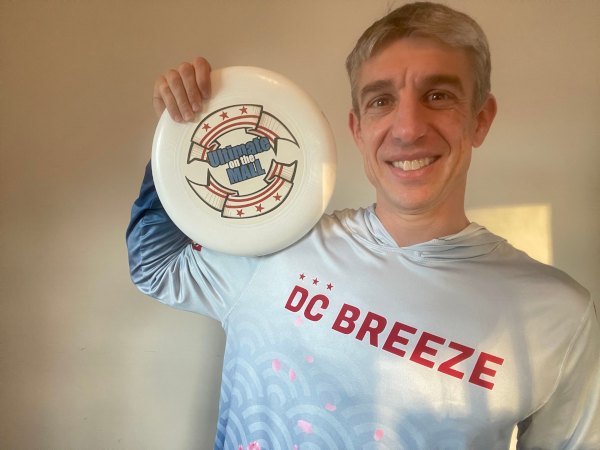 Jonathon Lunardi holding an Ultimate disc